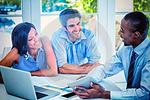 Couple and real estate agent discussing together