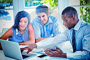 Couple and real estate agent discussing together