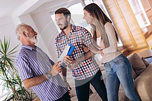 Couple with real-estate agent visiting house for sale