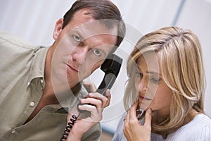 Couple receiving bad news over phone