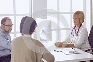 Couple at reception discussing issues with a sexologist