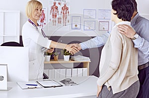 Couple at reception discussing issues with a sexologist photo