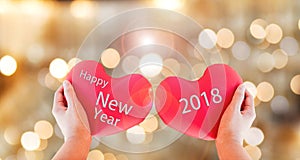 couple red heart with text happy new year 2018 on gold bokeh background