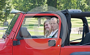 Couple in Red Jeep