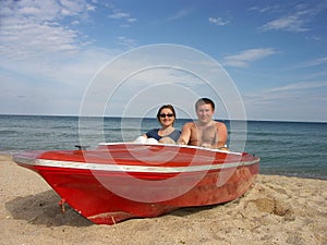 Couple in red motorboat