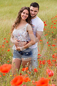 Couple in red poppies