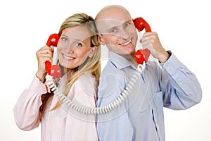 Couple with red telephones