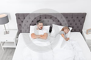 Couple with relationship problems in bed