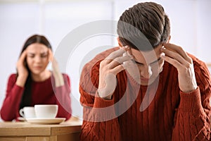 Couple with relationship problems at table