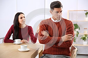 Couple with relationship problems at table