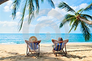 Couple relax on the beach enjoy beautiful sea on the tropical island