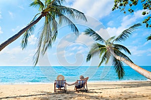 Couple relax on the beach enjoying beautiful sea on the tropical island