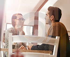 Couple, relax and talking with date for conversation, bonding or romance at indoor restaurant. Man and woman with smile