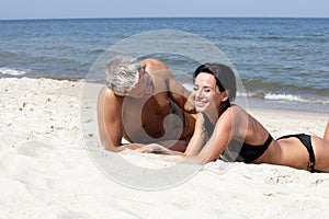 Couple relaxing on the beach