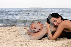 Couple relaxing on the beach