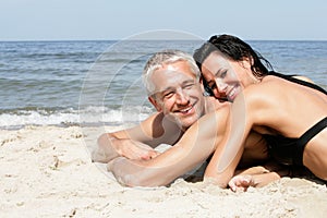 Couple relaxing on the beach
