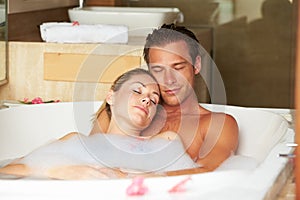 Couple Relaxing In Bubble Bath Together