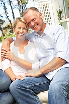 Couple Relaxing In Garden