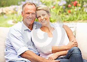 Couple Relaxing In Garden