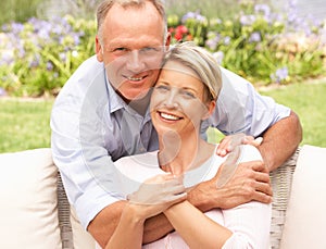 Couple Relaxing In Garden