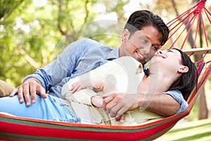 Couple Relaxing In Hammock