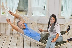 Couple relaxing in a hammock