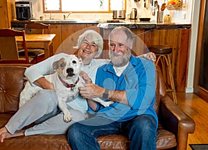 Couple relaxing at home and loving their pet. Positive image of life at home and New Normal