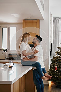 Couple relaxing at the kitchen during Christmas
