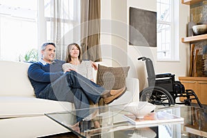 Couple relaxing in the living room photo