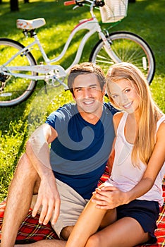 Couple relaxing in park.