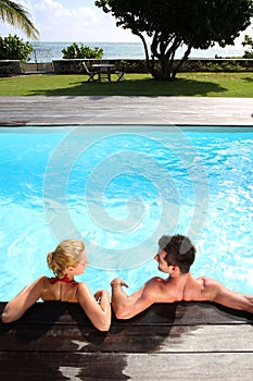 Couple relaxing in pool