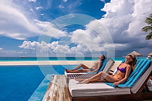 Couple relaxing at the poolside