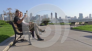 Couple relaxing on San Diego City bench