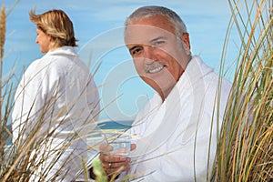Couple relaxing by the sea