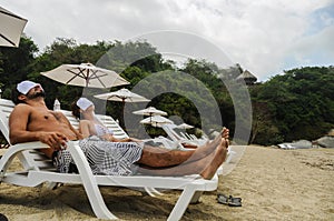 Couple Relaxing at SPA, Tayrona Beach Colombia. South America. L photo