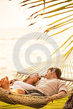 Couple relaxing in tropical hammock