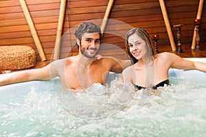 Couple relaxing in a whirlpool photo