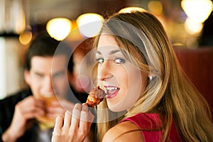 Couple in Restaurant eating fast food