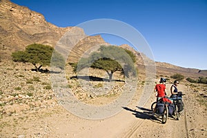 A couple resting during a cyclist tour in Morocco