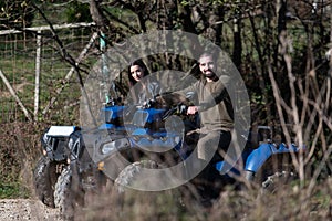 Couple Driving Off-road With Quad Bike or Atv