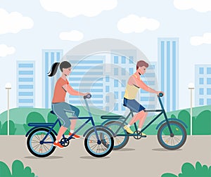 Couple are riding on bicycle on the urban lanscape background..Man and woman spends time outdoors