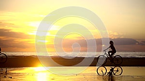 Couple Riding Bike at Sunrise