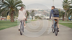 Couple riding bikes.