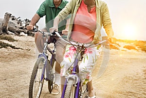 Couple Riding Bikes along Beach