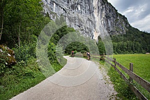 Couple riding bikes in Alps