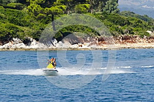 Couple riding on a jet ski in the Ionian Sea