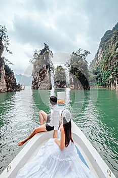 Couple riding a long tail boat to Khao Sok National Park, Phang Nga Province Khao Sok National Park with a long tail boat for