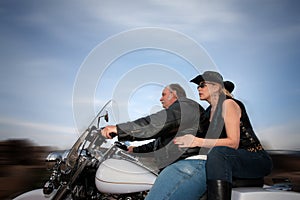 Couple riding a motorcycle