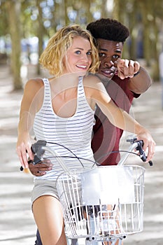 couple riding their bikes having fun on sunny day