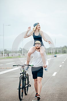 Couple riding their bikes in their free time and having fun on sunny autumn day.